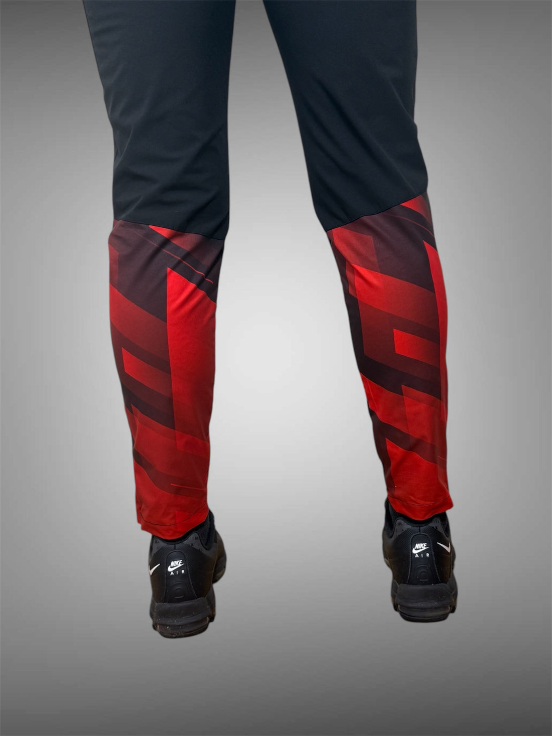 RED BLOCK PANEL REFLECT WINDBREAKER PANTS